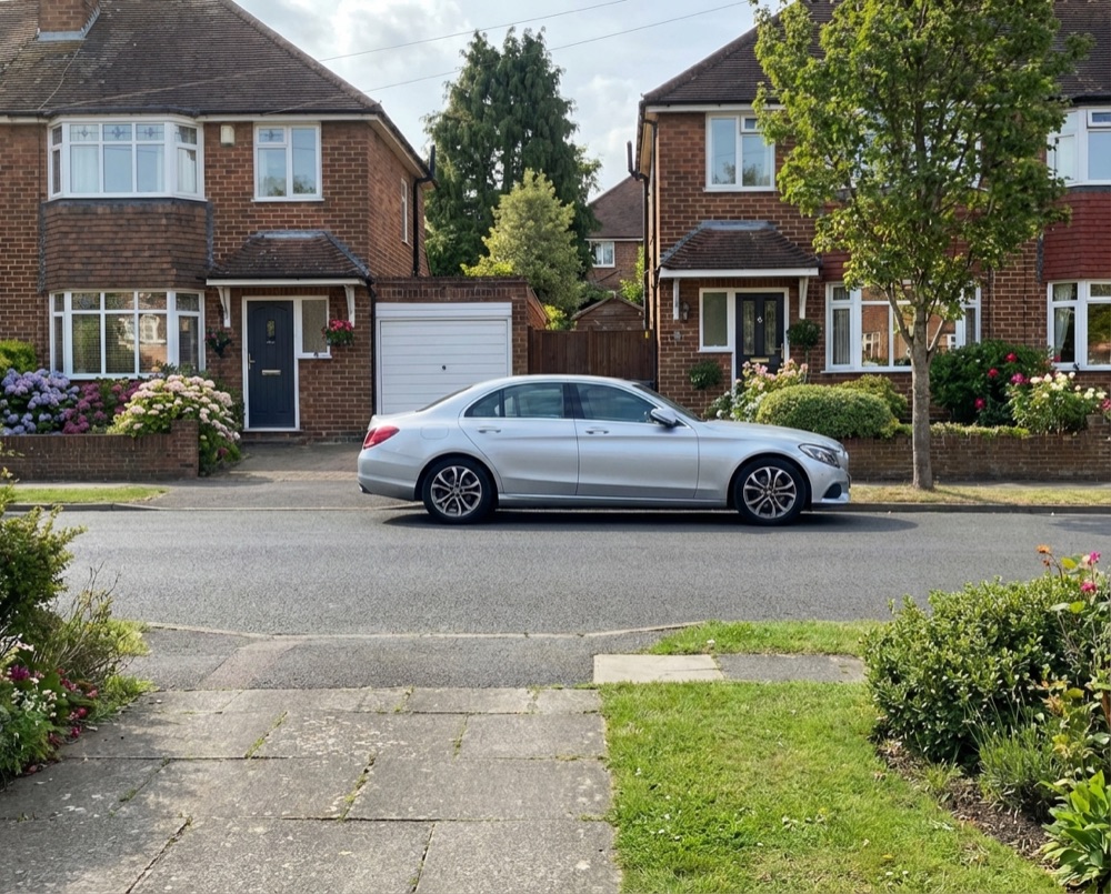 Residential street in Rustington with wheelie bins